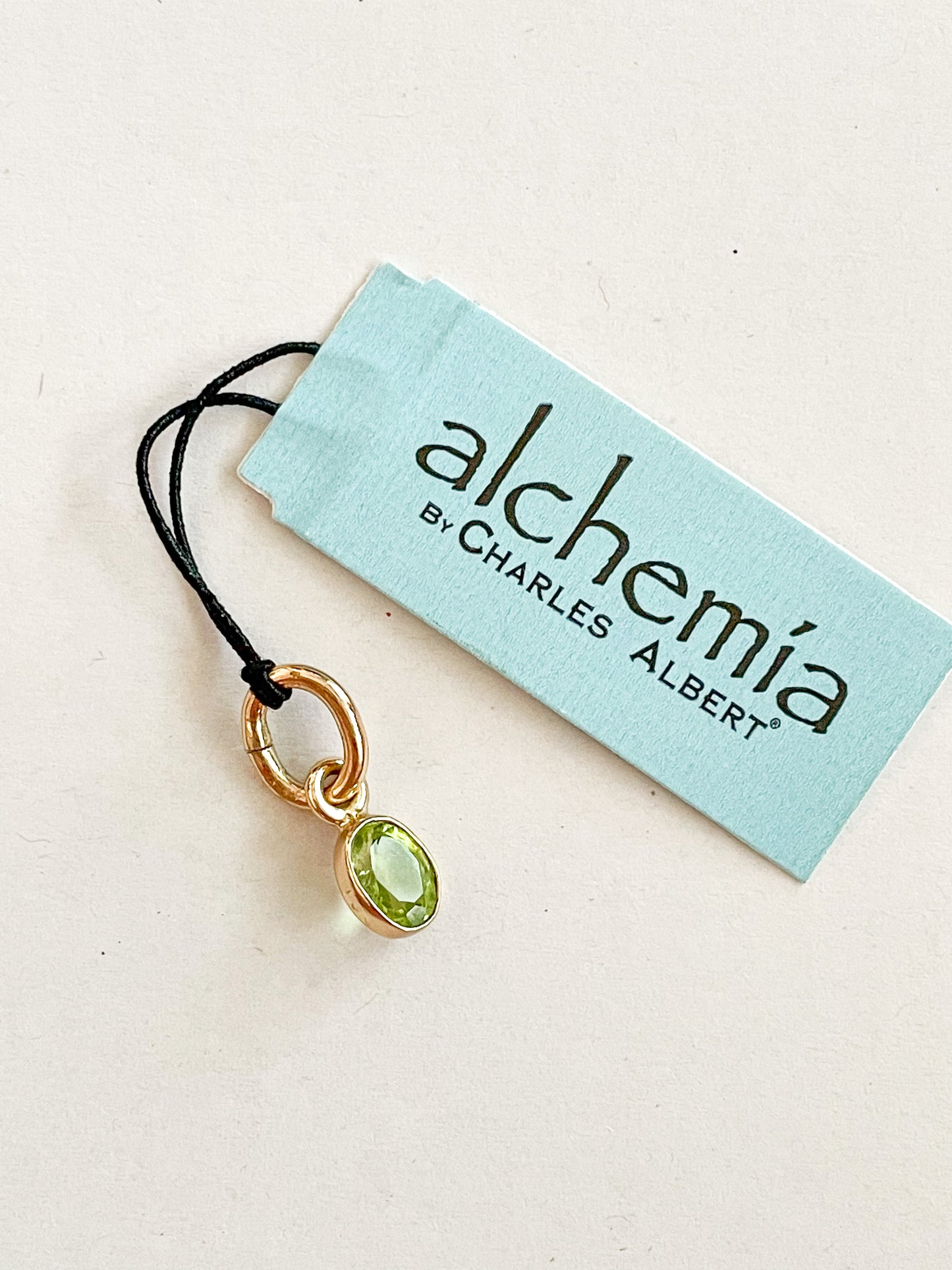 Dainty Peridot Charm - Alchemia