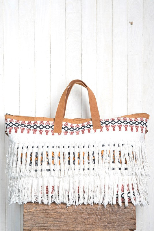 Hand embroidered, fringe getaway bag with suede trim detail.